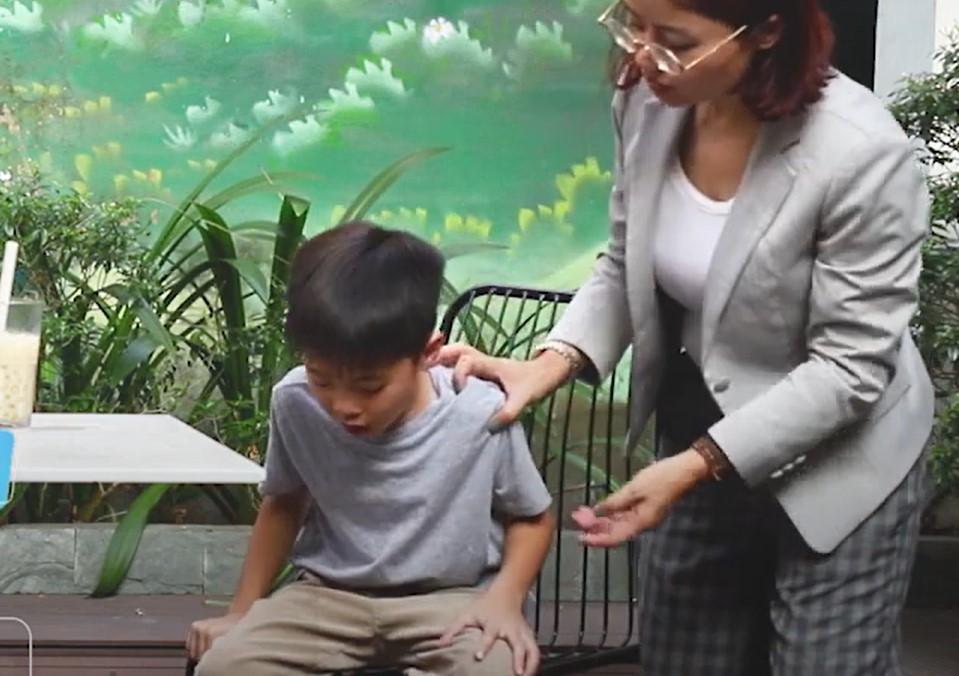 Encourage the victim to lean forward and continue to cough forcefully